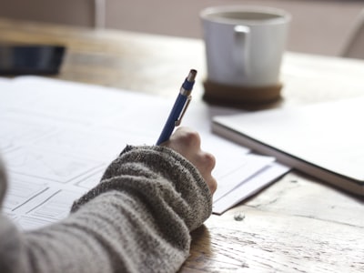 Person studying with notes — interactive quizzes